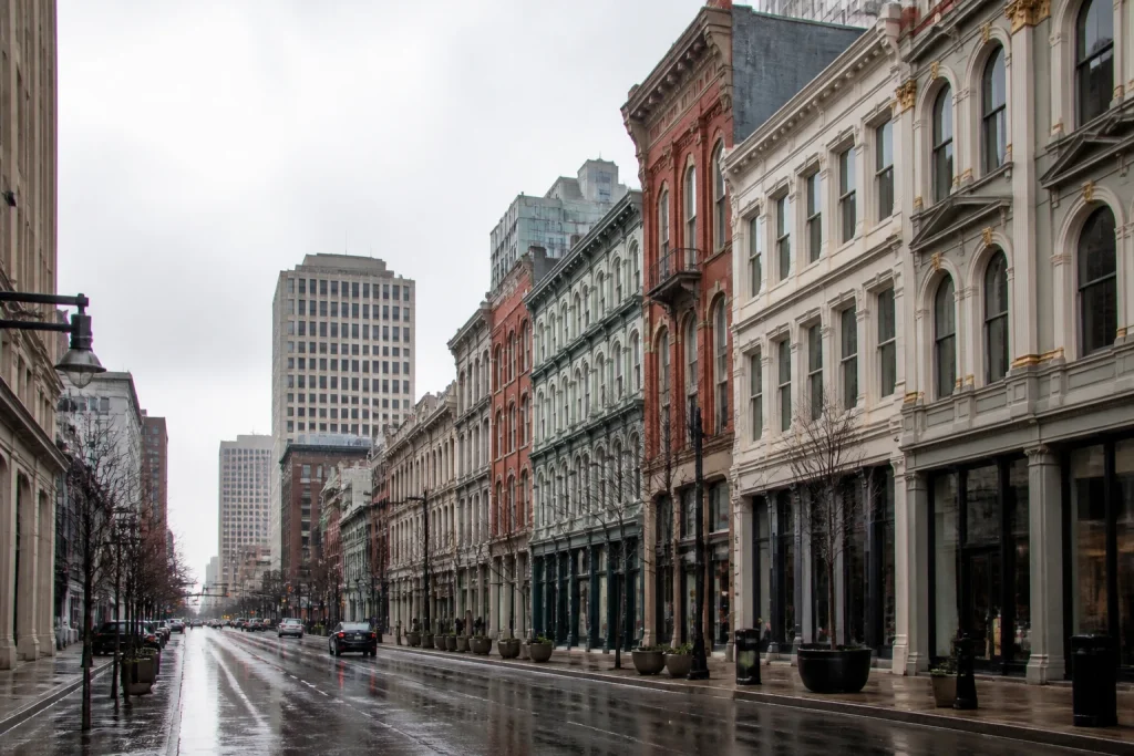 Historic cast-iron façades on Louisville's Main Street after spring rain